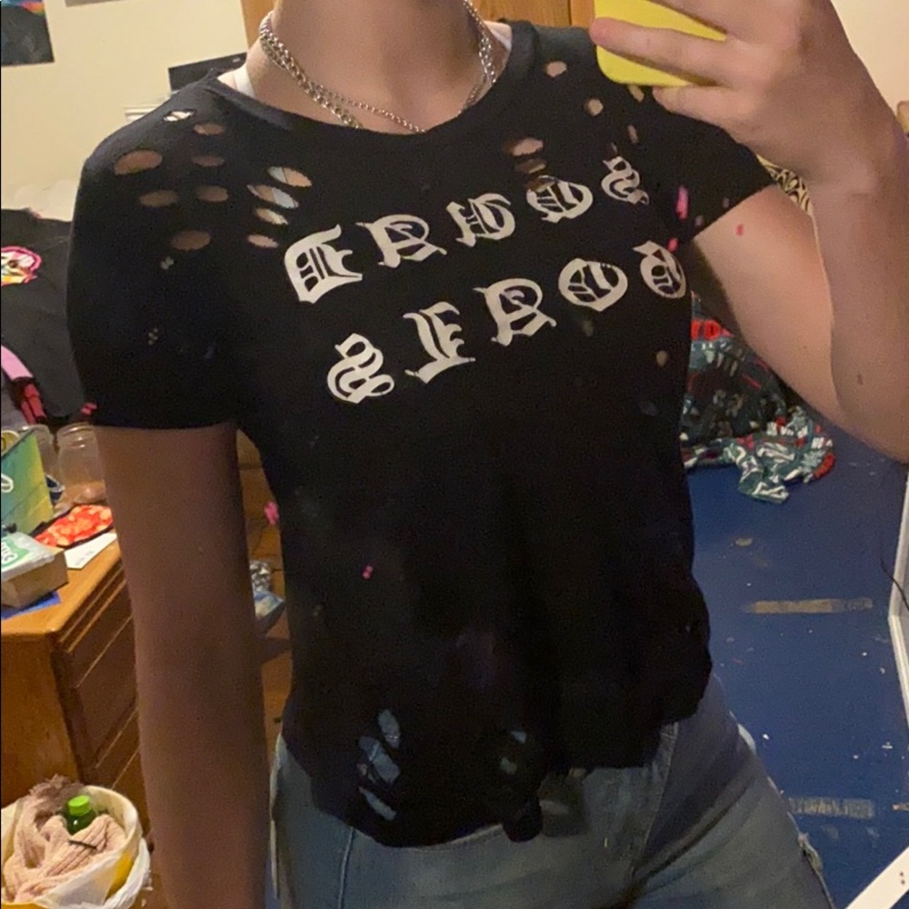 Trendy, distressed black tee